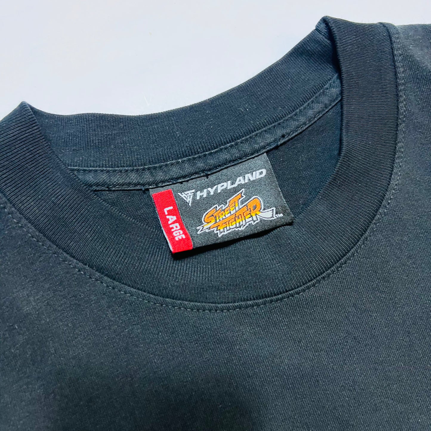 HYPLAND x Street Fighter II RYU AOP T-Shirt Gaming schwarz L - Cats on Stacks VNTG